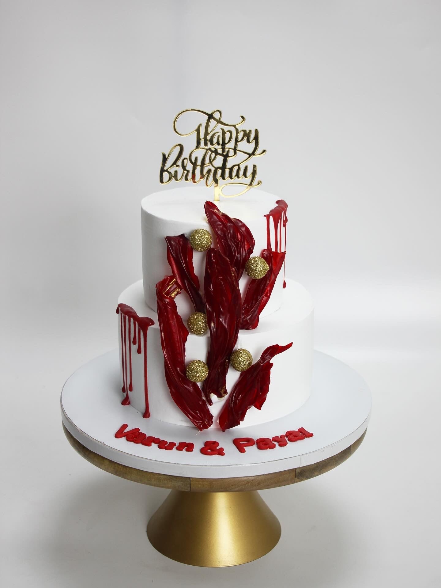 Crimson Elegance Two-Tier Abstract Sail Cake