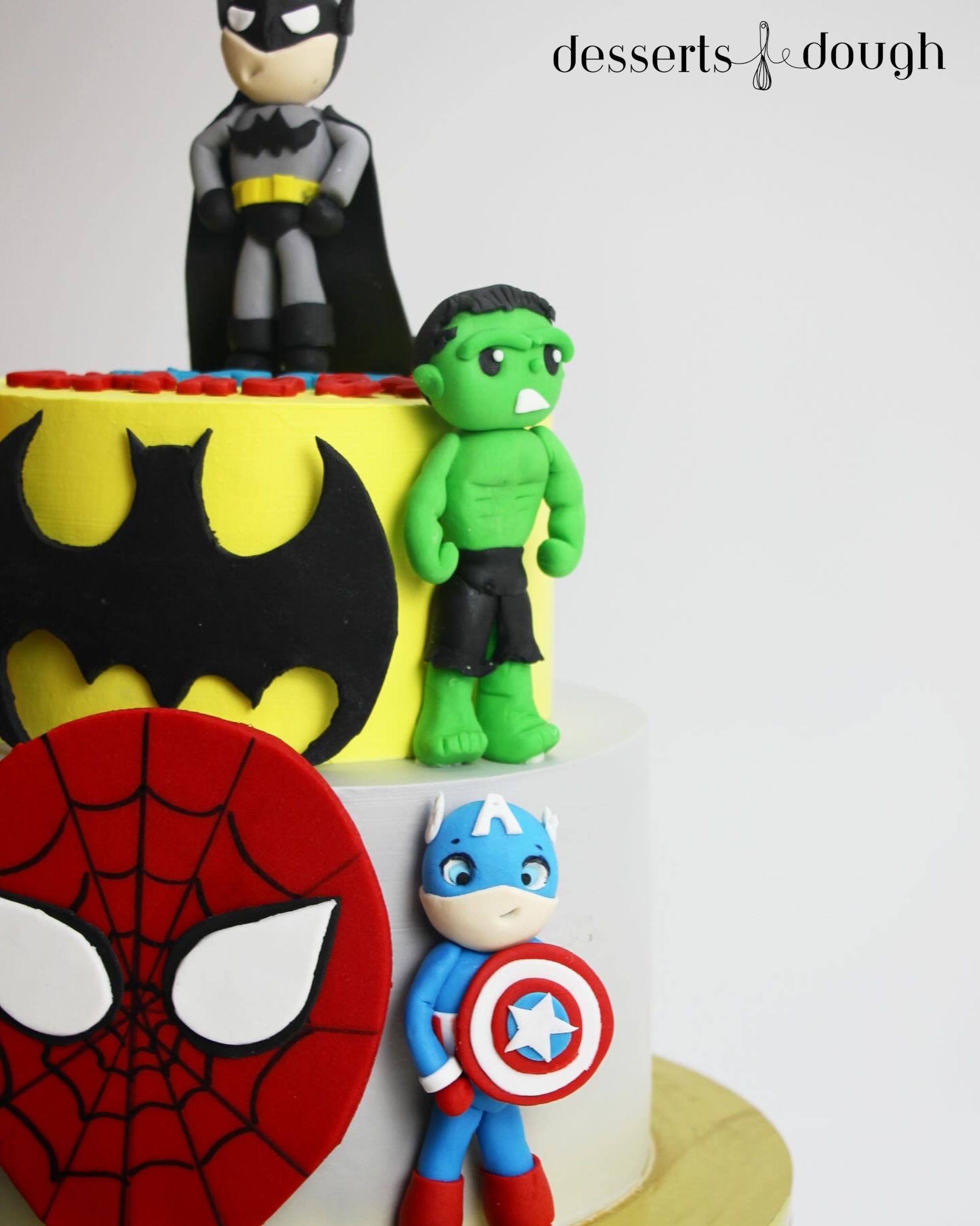 Earth’s Mightiest Two-Tier Superhero Assembly Cake